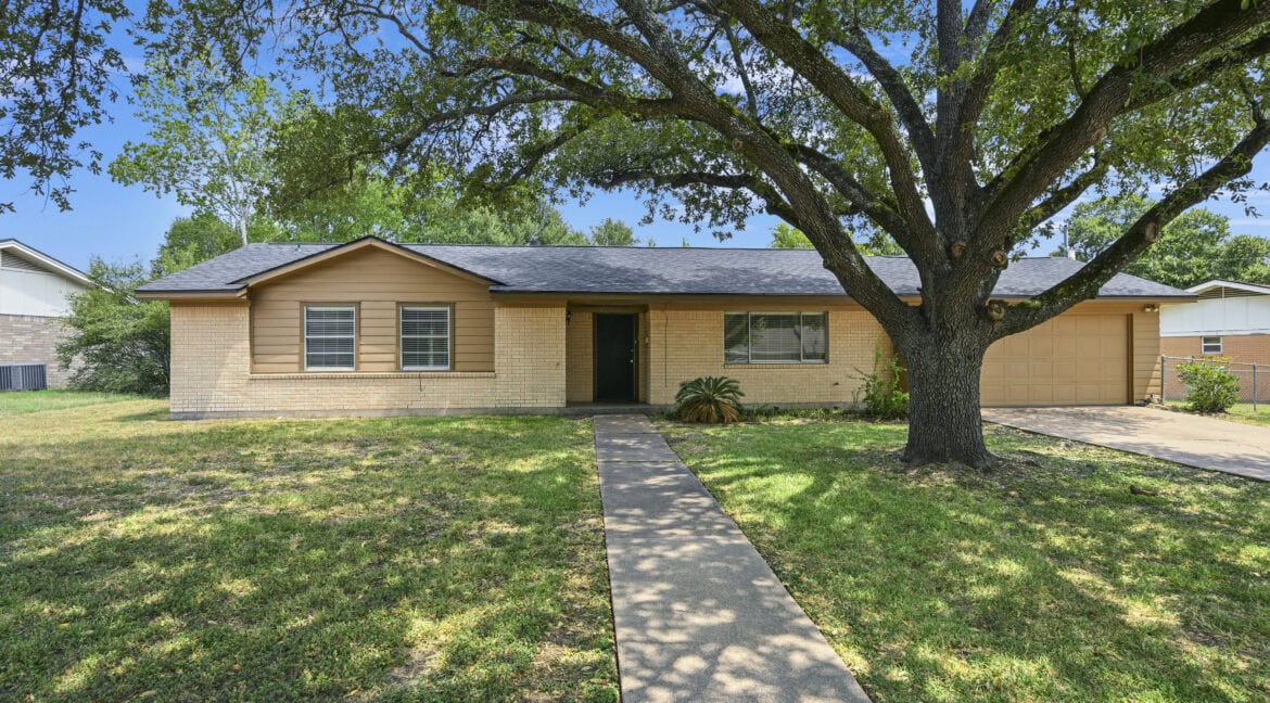 Single-story house with a large front yard and a big tree, located in Southside.