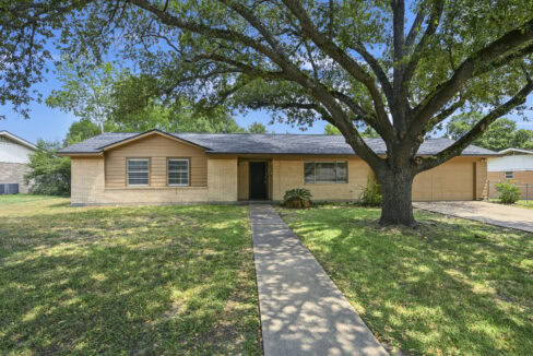 Single-story house with a large front yard and a big tree, located in Southside.